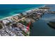Aerial view of waterfront homes on a canal and bay with beach access on Anna Maria Island at 2405 N Beach Rd # 10, Englewood, FL 34223