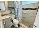 Bathroom featuring a large glass walk-in shower and modern vanity at 2405 N Beach Rd # 10, Englewood, FL 34223
