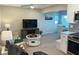 Inviting living room with comfortable seating and an open floor plan adjacent to the modern kitchen at 2405 N Beach Rd # 10, Englewood, FL 34223