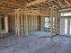 Interior of a house under construction with framing and windows on concrete floor at 254 White Marsh Ln, Rotonda West, FL 33947