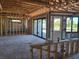 Living room construction featuring open frame and sliding glass doors to backyard at 254 White Marsh Ln, Rotonda West, FL 33947