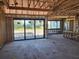 Living room construction with a sliding glass door with views of the backyard and pool at 254 White Marsh Ln, Rotonda West, FL 33947