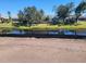 Scenic view of the property overlooking a canal with lush greenery and clear sky at 254 White Marsh Ln, Rotonda West, FL 33947