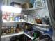Organized pantry shelves stocked with canned goods, snacks, and various household items at 26191 Angelica Rd, Punta Gorda, FL 33955
