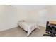 Bedroom with neutral carpet and walls; a simple, cozy space at 285 Alsace Ave, Venice, FL 34293