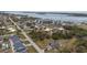 Aerial view of community near ocean with residential and commercial real estate at 3021 Holly Ave, Englewood, FL 34224