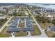 Aerial view of home with pool, shared driveway, and access to main road at 3021 Holly Ave, Englewood, FL 34224