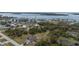Aerial view of property near harbor with commercial development and lush greenery at 3021 Holly Ave, Englewood, FL 34224