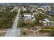 Aerial view of home with landscaping near a road and other residential properties at 3021 Holly Ave, Englewood, FL 34224