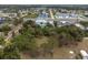 Aerial view of neighborhood property featuring lush greenery near shopping and restaurants at 3021 Holly Ave, Englewood, FL 34224