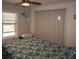 Bedroom featuring a tropical-patterned bedspread, a window for natural light, and a large closet at 3021 Holly Ave, Englewood, FL 34224
