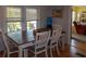 The dining room features lots of natural light and access to the living room at 3021 Holly Ave, Englewood, FL 34224