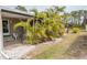 Lush tropical landscaping at 3021 Holly Ave, Englewood, FL 34224