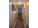 Inviting hallway featuring hardwood floors and coastal-themed decor leading to other rooms in the home at 3021 Holly Ave, Englewood, FL 34224