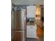 This kitchen features stainless steel appliances, granite countertops and access to the laundry room at 3021 Holly Ave, Englewood, FL 34224