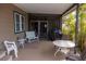 Covered and screened patio with outdoor seating and a barbeque at 3021 Holly Ave, Englewood, FL 34224