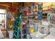 Well-organized utility room with shelving, water heater, and workbench at 3021 Holly Ave, Englewood, FL 34224