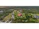Estate aerial view showcases the expansive property, landscaping, and surrounding nature at 3700 Como St, Port Charlotte, FL 33948