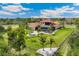A beautiful aerial shot showcases this lovely home, with a spacious lawn and plenty of trees for privacy at 3700 Como St, Port Charlotte, FL 33948