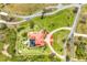 Expansive estate featuring a terracotta roof, circular driveway, and lush green lawns at 3700 Como St, Port Charlotte, FL 33948
