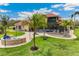 This backyard is the perfect spot to gather around the firepit, or relax under the shaded lanai at 3700 Como St, Port Charlotte, FL 33948