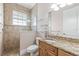 Bathroom featuring a walk-in shower, granite countertops, and neutral colors at 3700 Como St, Port Charlotte, FL 33948
