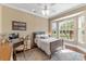 Cozy bedroom with a desk, bay window, and bed with soft linens at 3700 Como St, Port Charlotte, FL 33948