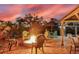 Enjoy a fire pit in this outdoor space overlooking the sunset and water access at 3700 Como St, Port Charlotte, FL 33948