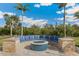 Cozy outdoor fire pit area with built-in seating, perfect for gatherings and enjoying cool evenings at 3700 Como St, Port Charlotte, FL 33948