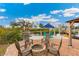 Fire pit in outdoor space with lots of seating and water access with a boat lift at 3700 Como St, Port Charlotte, FL 33948