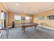 Recreation room with a stylish pool table, recessed lighting, windows for natural light, and outdoor access at 3700 Como St, Port Charlotte, FL 33948