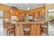 Kitchen featuring a breakfast bar and custom wood cabinetry at 3700 Como St, Port Charlotte, FL 33948