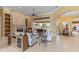 Bright living room features tile flooring, fireplace, and direct access to outdoor entertaining at 3700 Como St, Port Charlotte, FL 33948