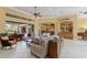 Spacious living room seamlessly connects to outdoor dining and a full bar, perfect for entertaining at 3700 Como St, Port Charlotte, FL 33948