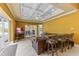 Inviting living room with tile flooring and access to the outdoor pool area at 3700 Como St, Port Charlotte, FL 33948