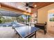 Expansive outdoor area featuring an outdoor kitchen, ping pong table, smoker and view of the pool at 3700 Como St, Port Charlotte, FL 33948