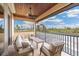 Outdoor patio with comfortable seating, wooden ceilings, a ceiling fan, and scenic views of nature at 3700 Como St, Port Charlotte, FL 33948