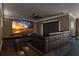 The tiered seating in this home theater offers an immersive experience for movie nights and entertainment at 3700 Como St, Port Charlotte, FL 33948