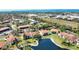 Aerial view of a beautiful community with the homes surrounding a peaceful pond and well-maintained yards at 405 Pine Hollow Cir # 405, Englewood, FL 34223