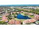 Beautiful aerial view of a condo community surrounding a picturesque pond with access to the Gulf of Mexico at 405 Pine Hollow Cir # 405, Englewood, FL 34223