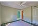 A simple bedroom featuring tile flooring, showing an open doorway to other rooms at 405 Pine Hollow Cir # 405, Englewood, FL 34223
