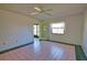 Tiled bedroom features a ceiling fan and an outdoor view at 405 Pine Hollow Cir # 405, Englewood, FL 34223