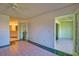 Bright bedroom featuring tile floors and access to the kitchen and lanai at 405 Pine Hollow Cir # 405, Englewood, FL 34223
