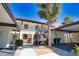 Exterior view of a multi-unit condo complex showing carports and stairs to upper units at 405 Pine Hollow Cir # 405, Englewood, FL 34223