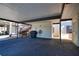 A covered carport with a barbecue grill, bike and exterior stairway to 2nd floor units at 405 Pine Hollow Cir # 405, Englewood, FL 34223