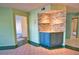 Dining area with custom wall and cabinetry, flowing seamlessly to other spaces at 405 Pine Hollow Cir # 405, Englewood, FL 34223