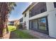 Exterior view of condo showing lanai, landscaping and proximity to pond at 405 Pine Hollow Cir # 405, Englewood, FL 34223