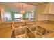 Stainless steel sink and granite countertops compliment an open concept kitchen with views into the dining area at 405 Pine Hollow Cir # 405, Englewood, FL 34223