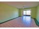 Spacious room that features large windows and tile flooring at 405 Pine Hollow Cir # 405, Englewood, FL 34223