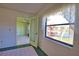 Sunroom with large windows offers picturesque views of the surrounding landscape at 405 Pine Hollow Cir # 405, Englewood, FL 34223